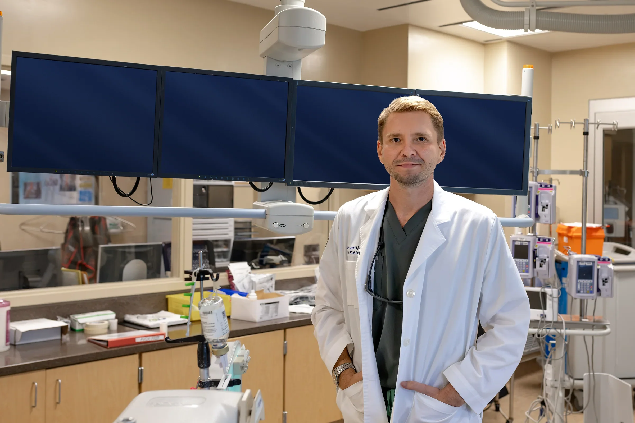 Dr. Yaranov in a white coat in a cardiac catheterisation lab