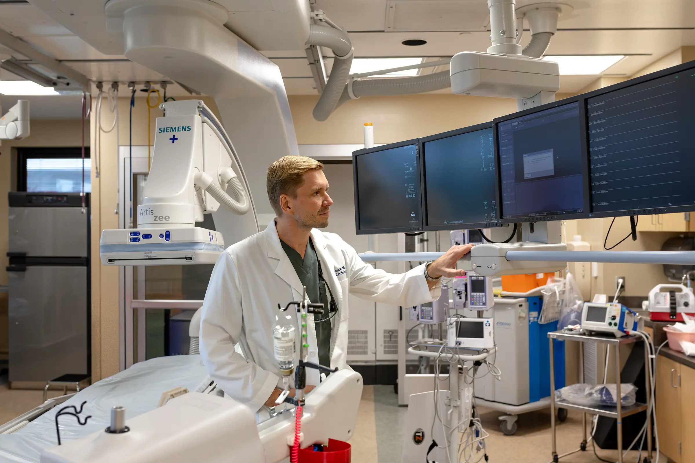 Dr. Yaranov reading the imaging monitors in the catheterisation lab
